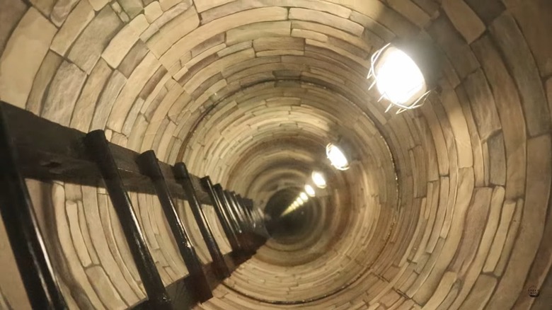 The interior of a circular infinity table with ladder and lighting effects