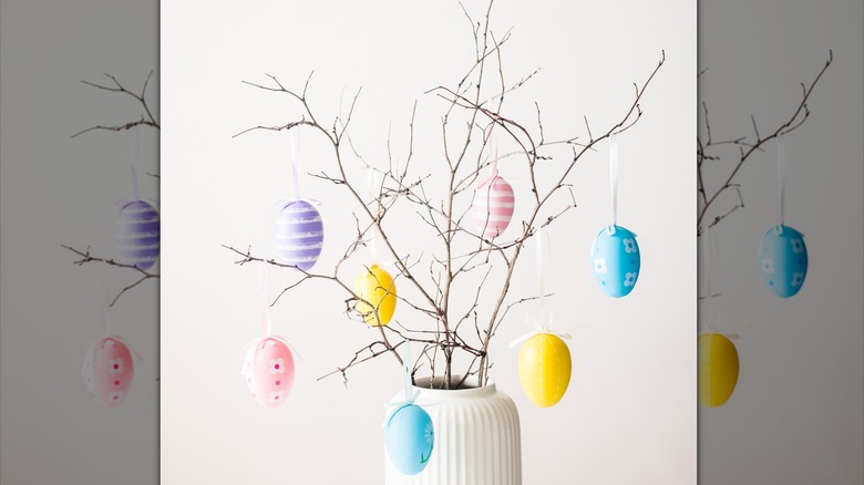 A DIY Easter tree with colorful eggs hanging from branches