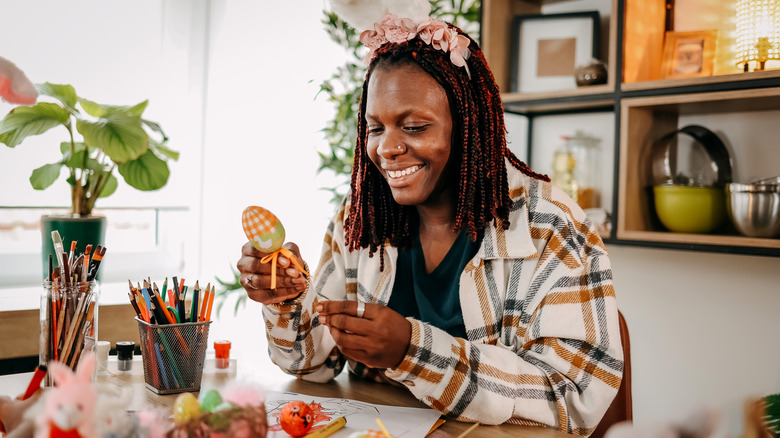 A person is making an Easter craft