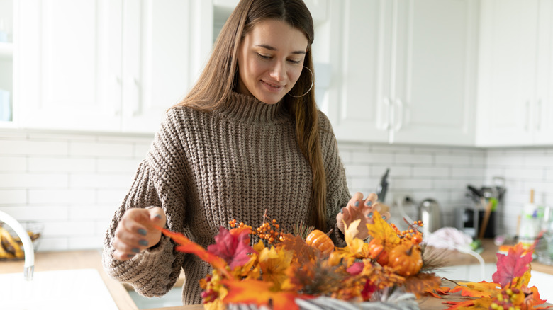 Girl with autumn craft supplies