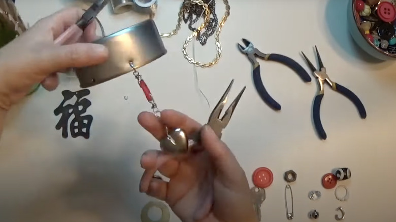 hands holding DIY wind chime