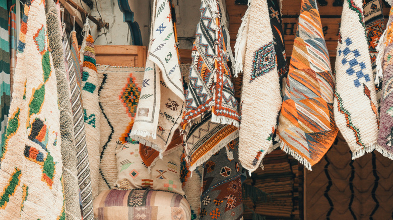 Display of Moroccan rugs at a market