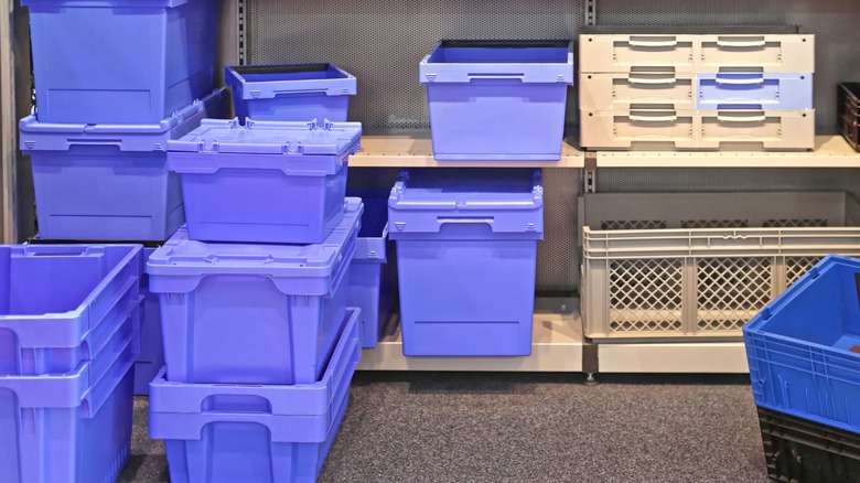 blue tote bins on metal shelving