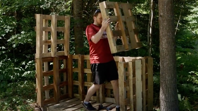 stacking pallets to create walls of shed