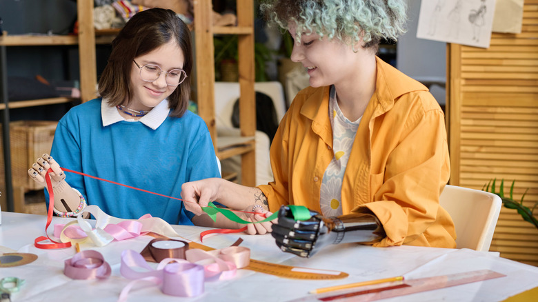 People unwinding ribbon for their DIY