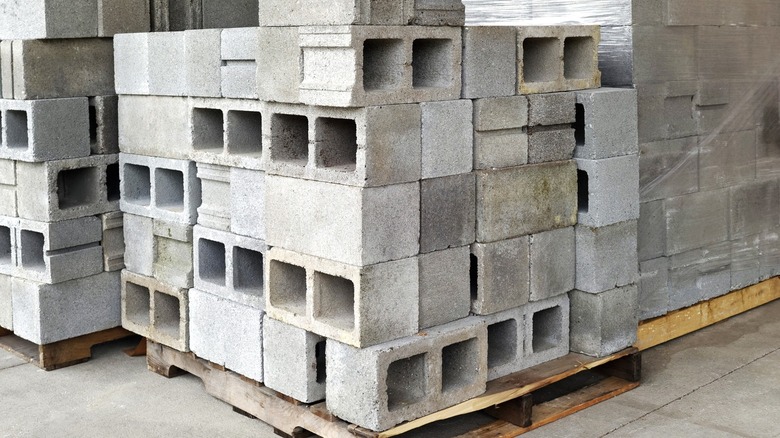 three pallets of stacked cinder blocks