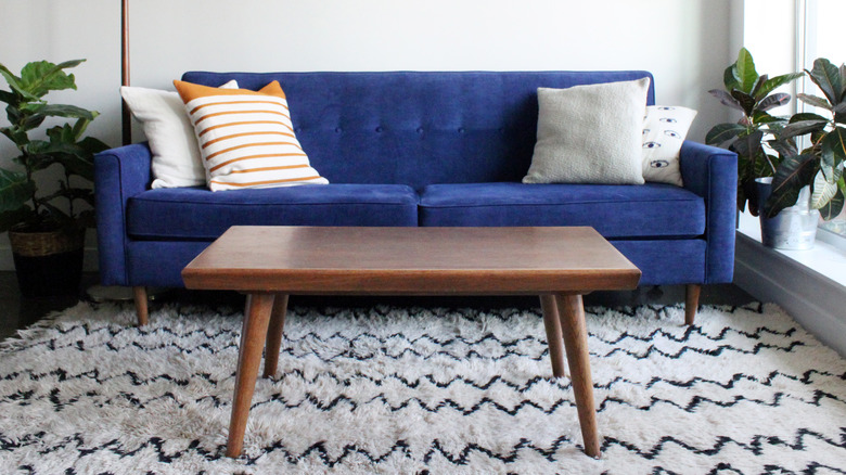 Coffee table and blue sofa