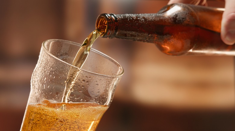 Pouring beer into glass