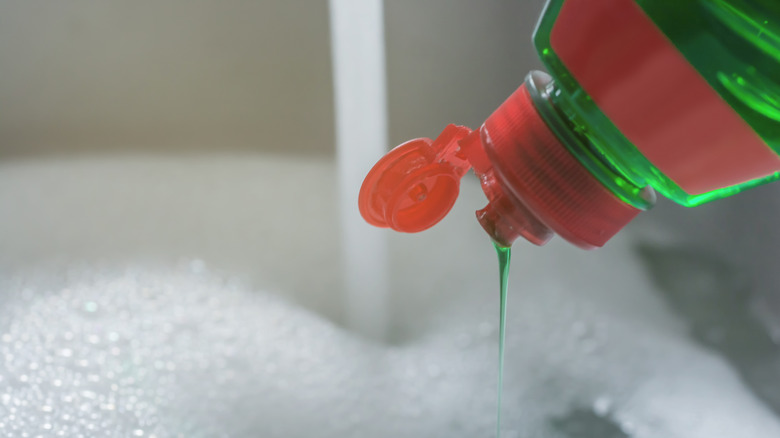 Pouring dish soap