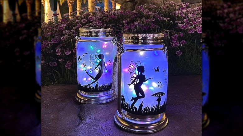 Jar lanterns with fairy patterns on them