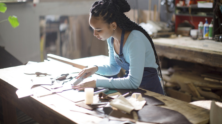 Someone creating something in a craft room