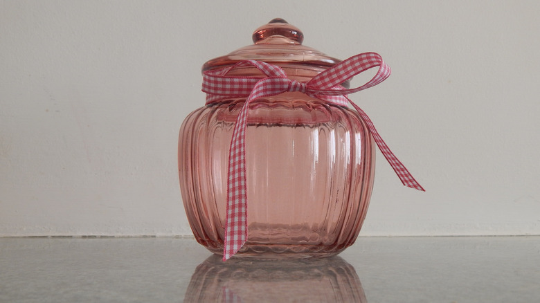 red glass jar with ribbon