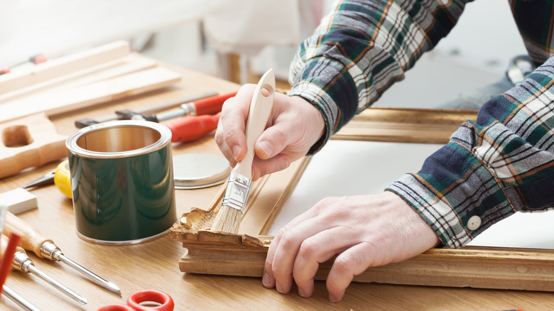 Person repurposing a frame