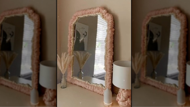 mirror with pink foam frame