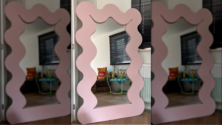 floor mirror with pink squiggle frame