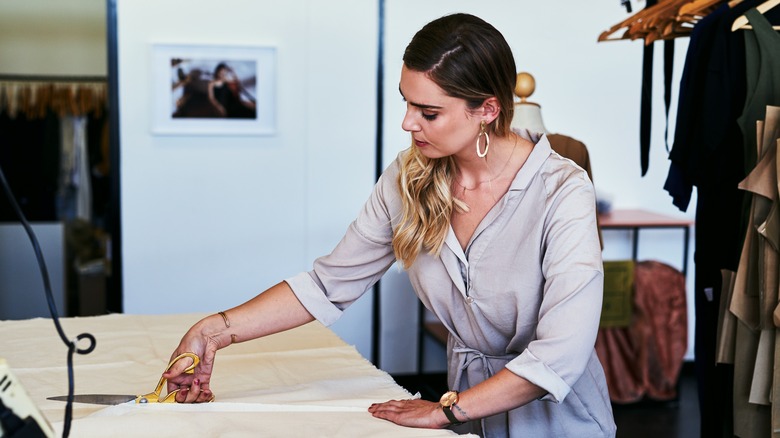 Woman cutting fabric 