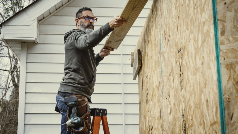 man building shed