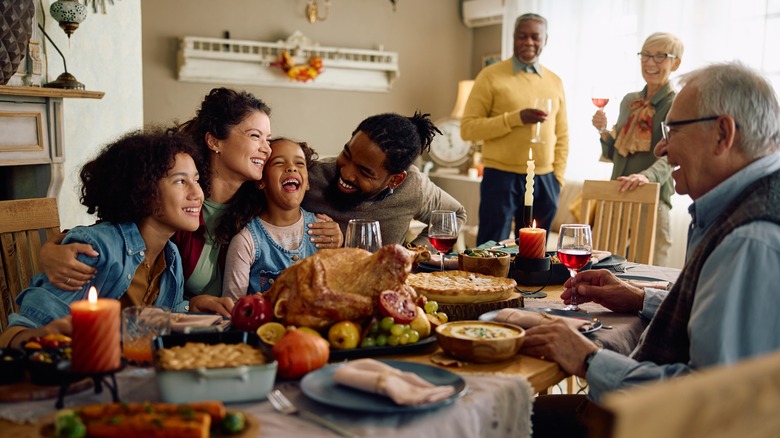 happy family around Thanksgiving table