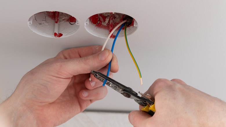 person repairing wiring