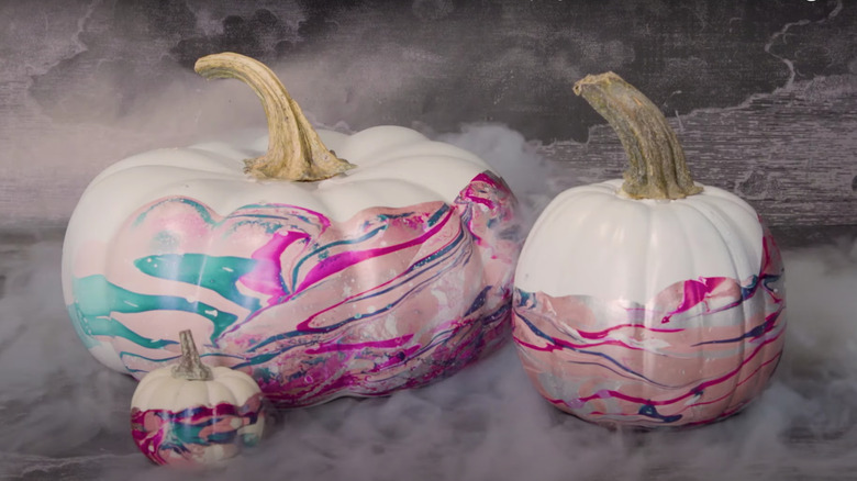 Colorful marble dipped pumpkins