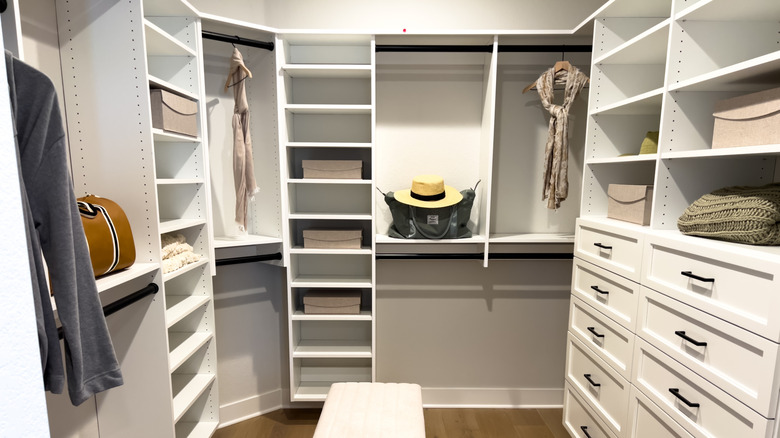 A luxurious custom closet with shelves and drawers