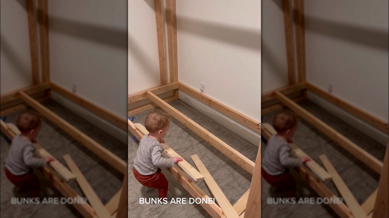 Child assembling bunk bed