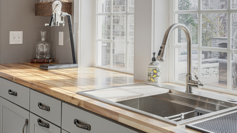 A bright kitchen with beautiful natural wood butcher block countertops