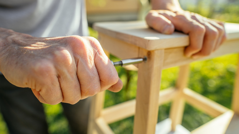 Someone creating their own outdoor furniture