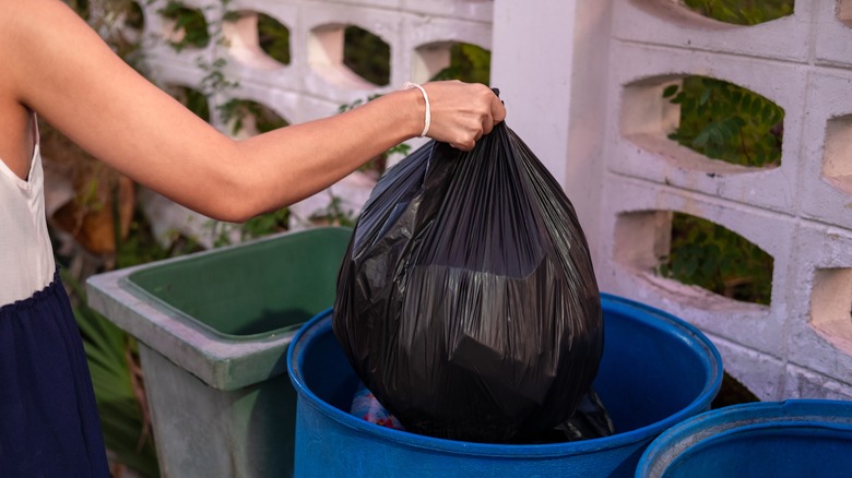 Taking trash out to bin