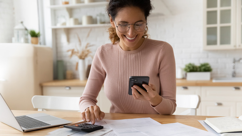 Woman reviewing financial documents 