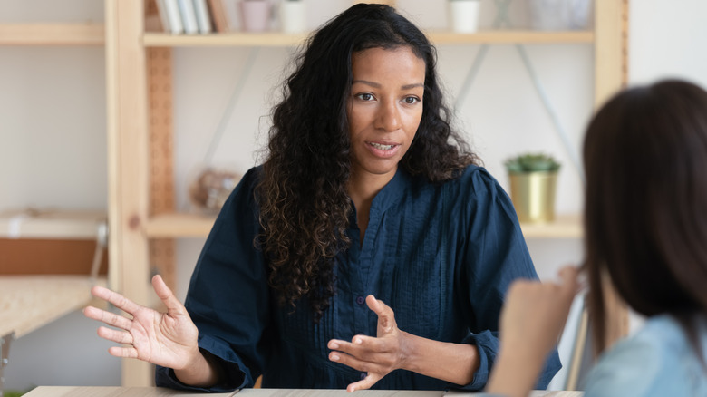 Woman discussing insurance with client