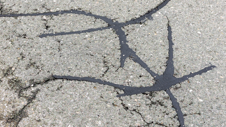 Close-up of cracks on asphalt