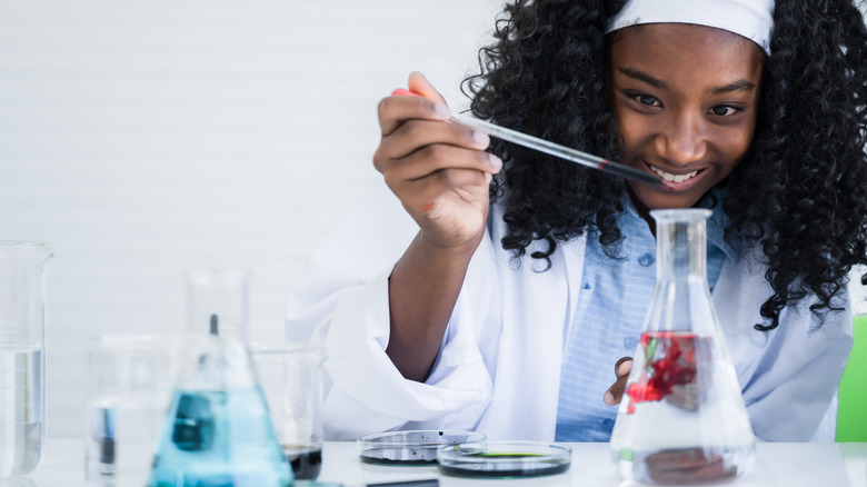 chemistry woman with beakers