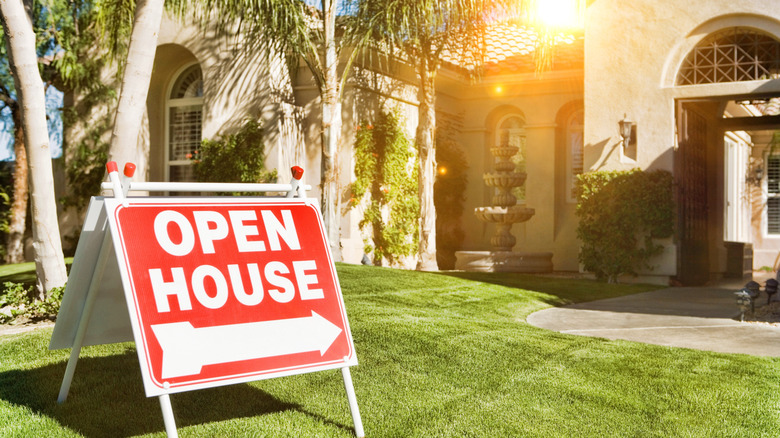 open house sign on lawn