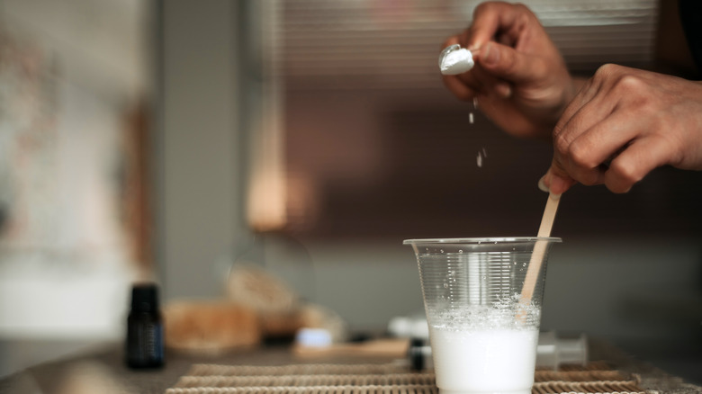 A woman creating a baking soda mixture