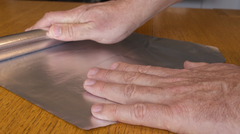 pulling aluminum foil