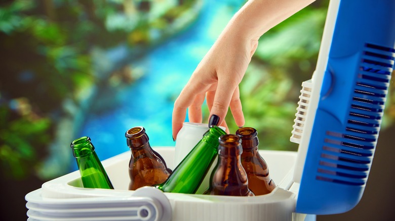 Person reaching into cooler