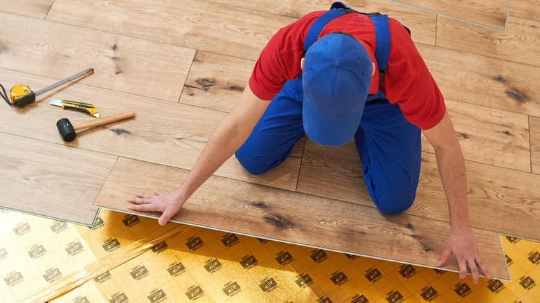 fitting planks into the grooves