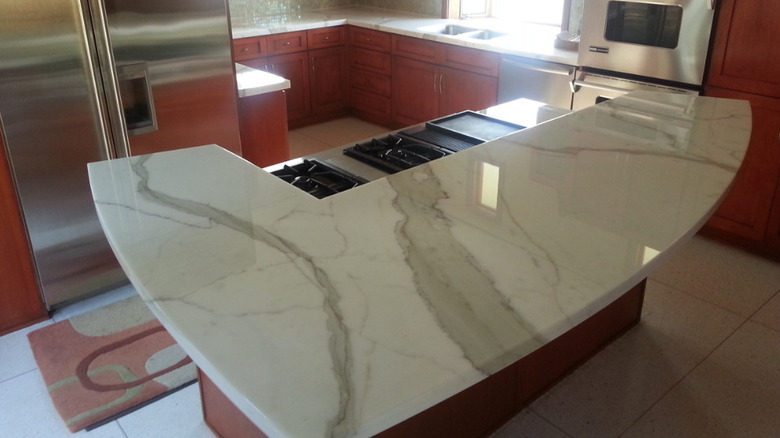 A marble countertop on a kitchen island that is coated with Tuffskins