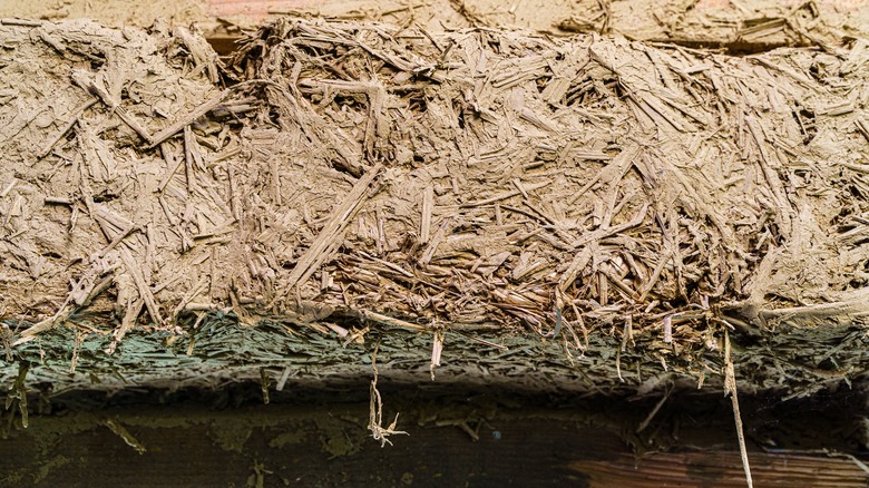 Close-up of cob mixture: stray, clay, sand, and water