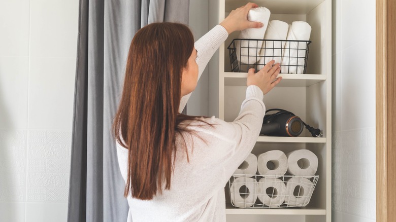 woman using storage bins