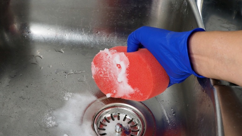 Baking soda paste cleaning sink