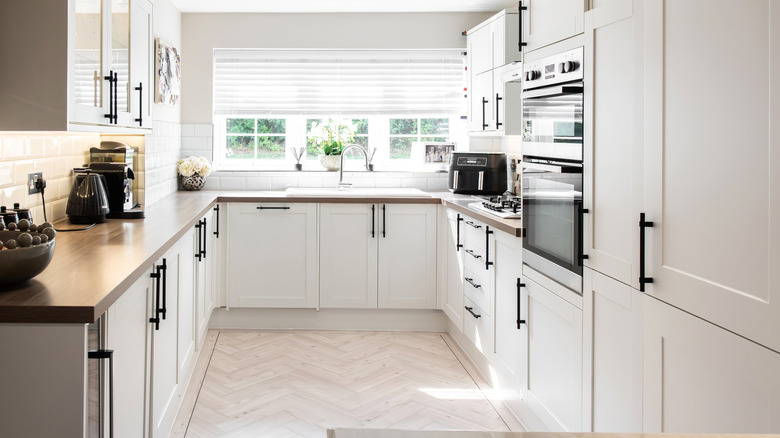 A modem white kitchen in a house