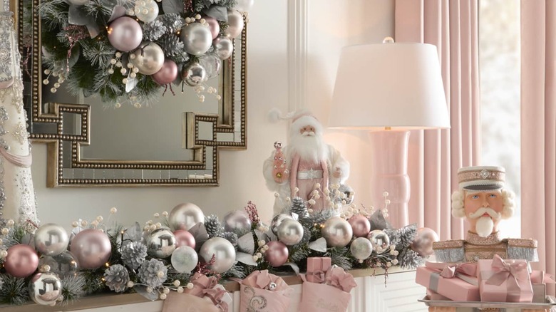 Mantle with highly matching blush pink wreath, garland, and Santa decor