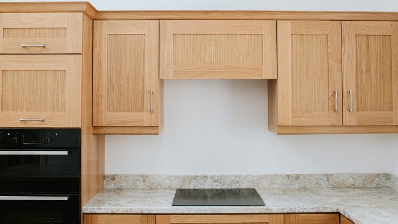 Wood shaker kitchen cabinets with granite countertop