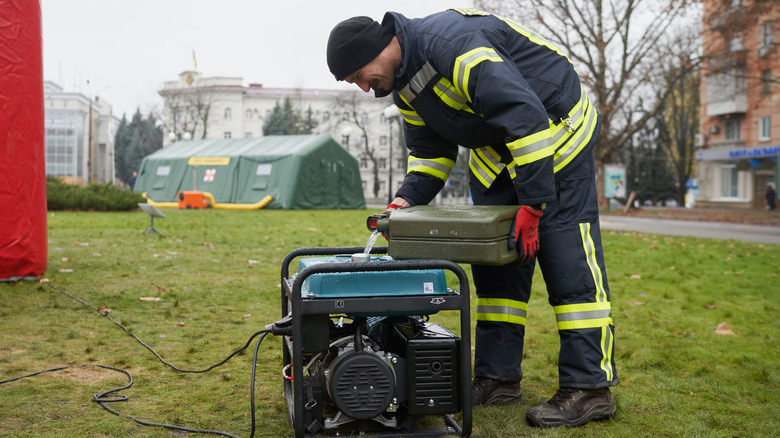 person refueling generator 