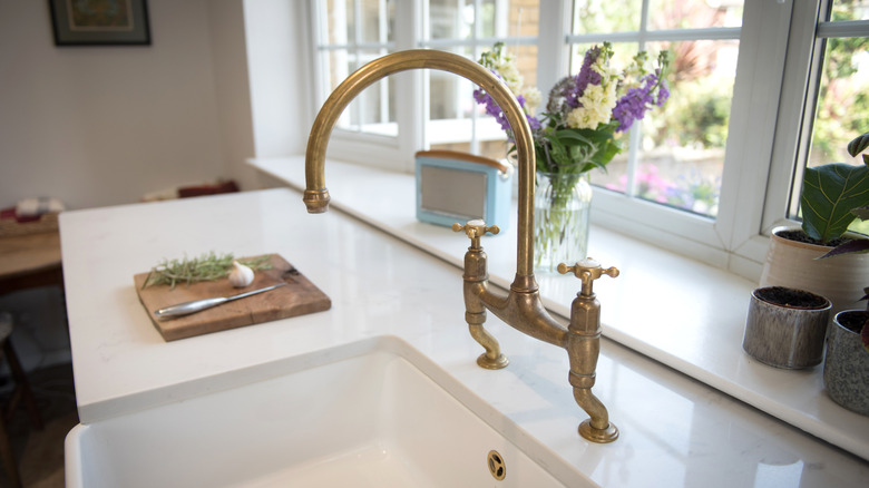 Brass faucet in kitchen during the day