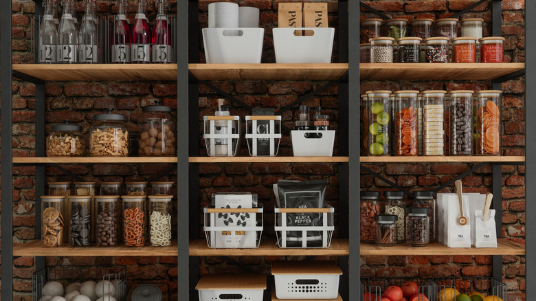 pantry with organizers and tall glass jars