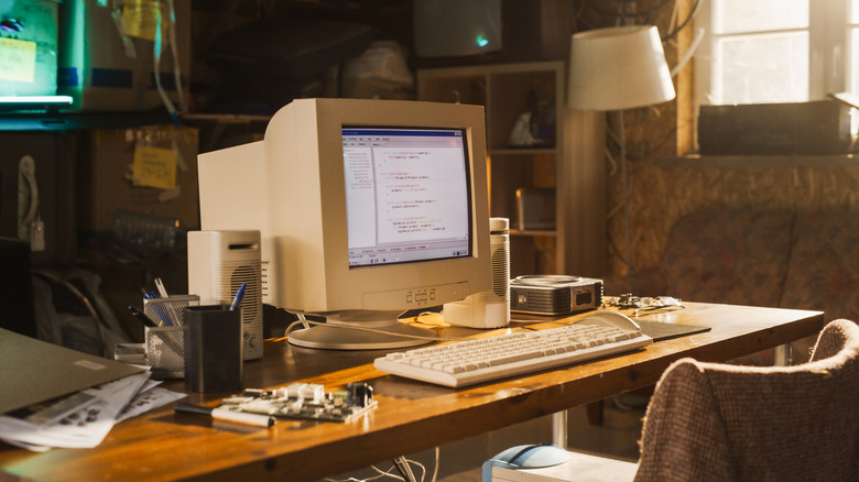 An old desktop computer on a desk in a home office