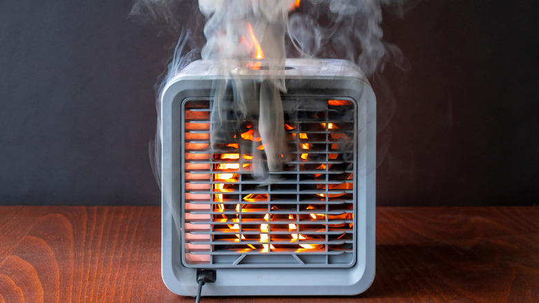 An air purifier on fire and smoking